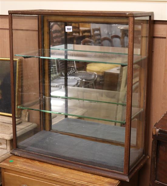 A glass display cabinet W.62cm
